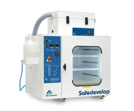 A 2023 Safedevelop lab vent hood features a transparent front door, control panel on the left, air exhaust hose on top, and multiple shelves inside. This modern design is supported by grants from the Bellevue Police Foundation.