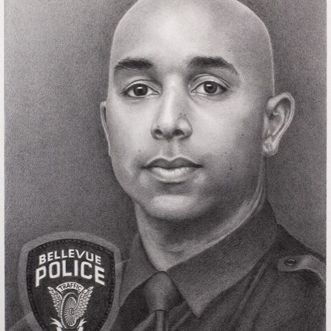 Portrait of Officer Jordan Jackson in uniform, proudly displaying the Bellevue Police badge, serving as a memorial to his dedicated service.